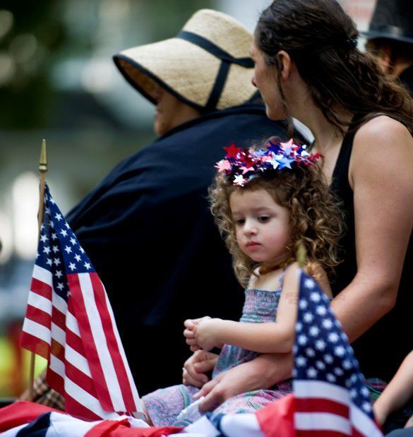Girl and mother in parade, 2013